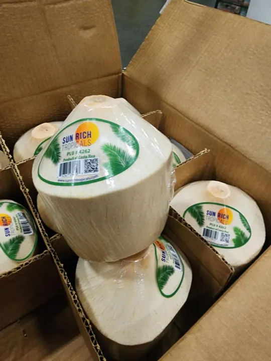 Box full of Cocotico's fresh diamond shaped coconuts